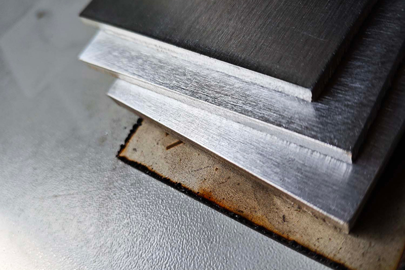 Why do metal sheets need to be deburred and chamfered?